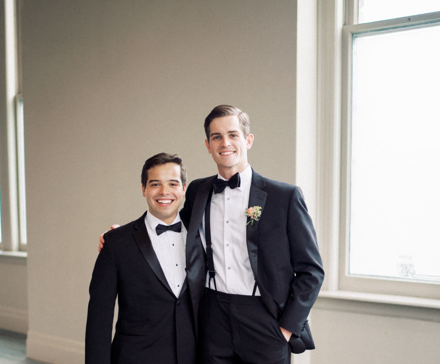 Henry and Steven in tuxedos at a wedding